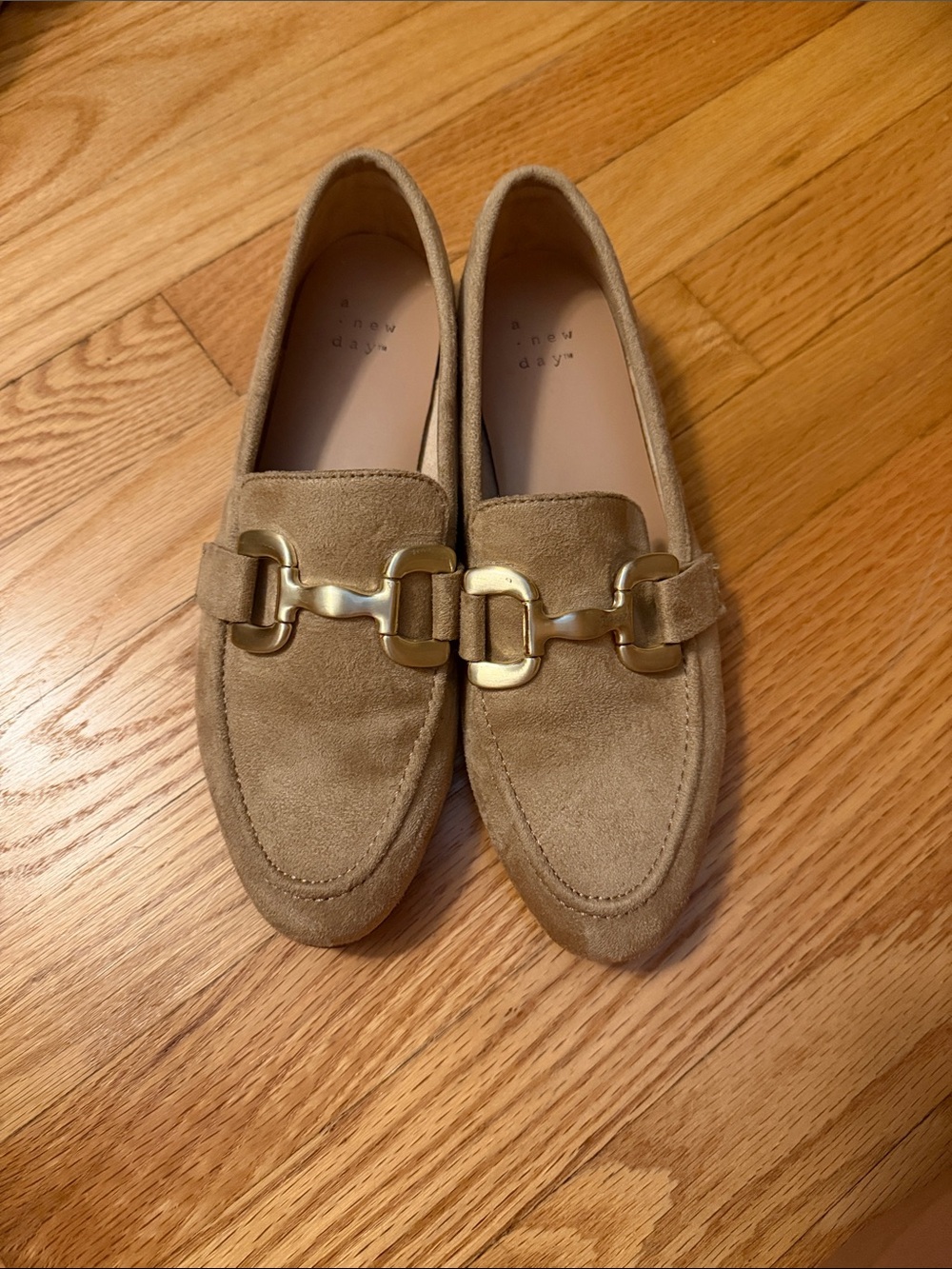 Tan flats with gold buckle